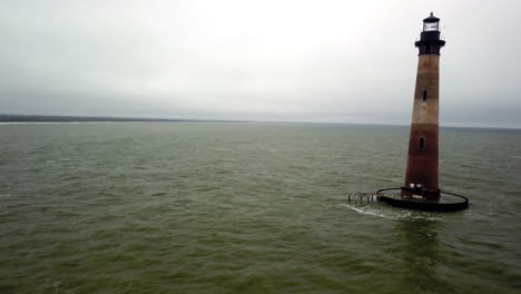 Aerial-pass-of-the-Morris-Island-Lighthouse-which-stands-at-the-southern-side-of-the-entrance-to-Charleston-Harbor