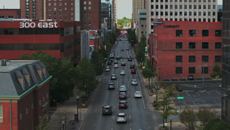 aerial drone view flying down e main st following traffic in downtown lexington, kentucky