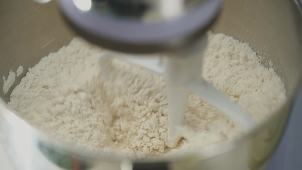 Mixing dough using a kitchen machine slow motion