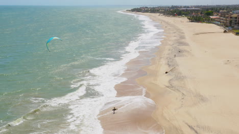 Aerial-view-of-person-practing-kite-surf,-Cumbuco,-Ceara,-Brazil