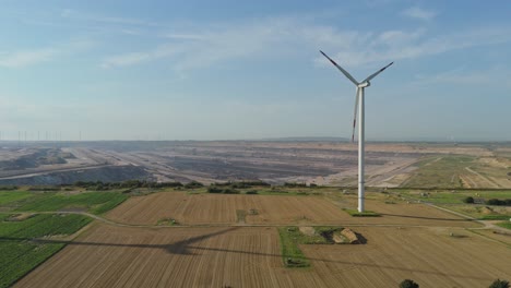 wind farm overlooking garzweiler open-cast coal mine in north-rhine westphalia, germany