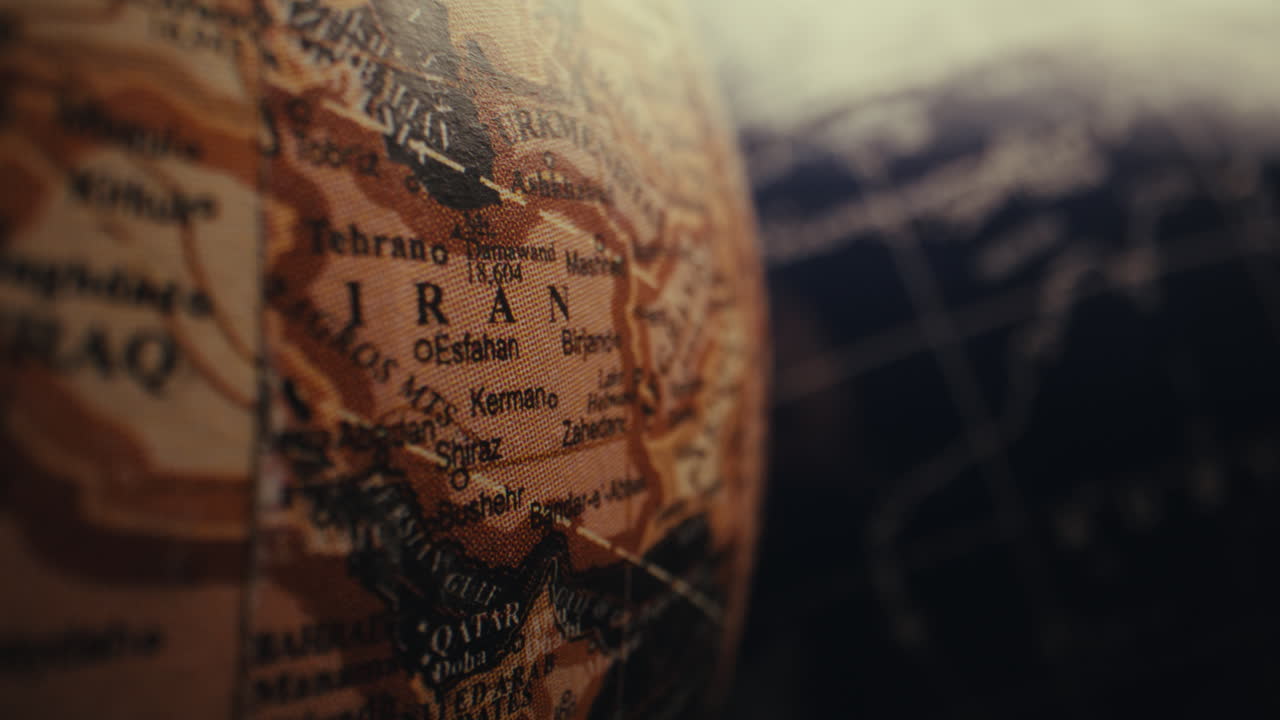 Close-up of a vintage globe, focused on the Iran region.