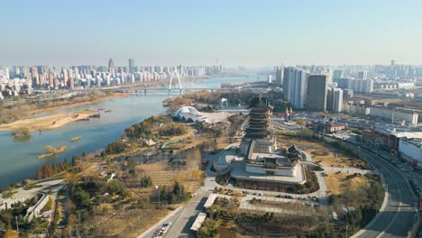 An-aerial-of-the-downtown-view-of-Linyi-in-Shandong-Province,-China,-featuring-the-Benghe-River-and-Art-Museum,-a-place-for-performances,-training,-exhibitions,-creation,-and-cultural-heritage