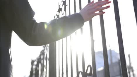 woman by a fence