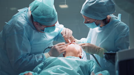 dentists during surgery for implant placement. dental clinic concept.