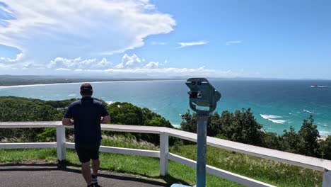 person enjoying and observing a coastal landscape