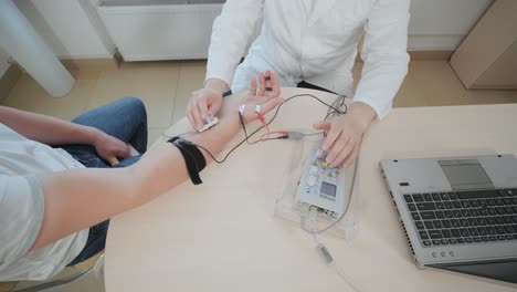 patient nerves testing using electromyography at medical center