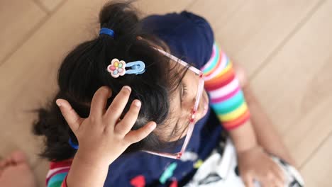 child playing with hair