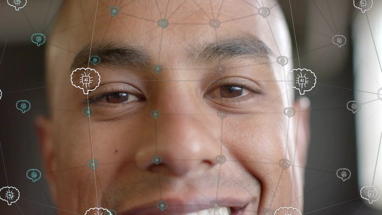 Man opening eyes and smiling after blink responding to AR brain network shifting over face tech