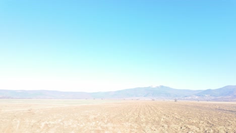 autumn footage of farm fields in bulgaria with the balkan mountains in the background