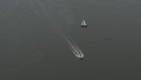 Drone-shot-of-two-boats-pass-close-to-each-other-in-the-sea