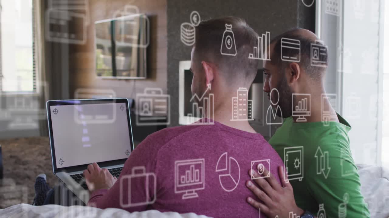 animación de iconos sobre una pareja masculina diversa usando una computadora portátil con espacio de copia.