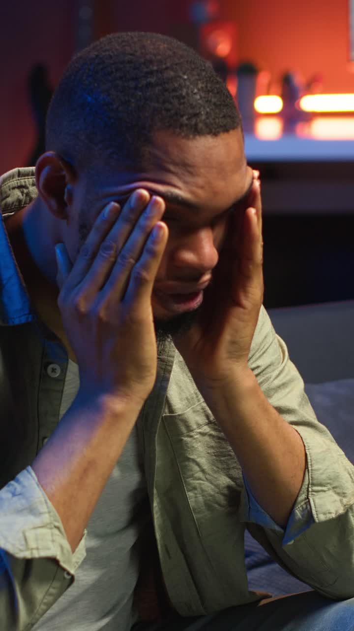 Vertical Video Stressed young adult fearing failure and struggling with deadlines