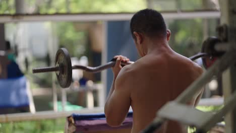 Man doing weightlifting in a gym