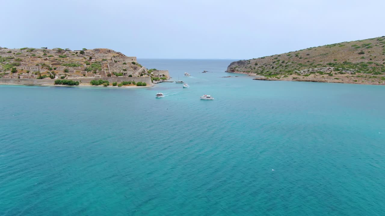 Panoramic view of Mediterranean sea. Motorboats near the Island of Spinalonga