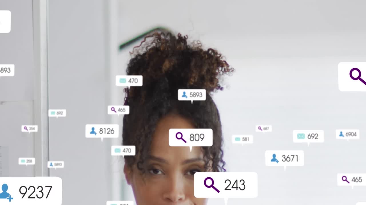 Animation of social media icons and data processing over african american businesswoman in office
