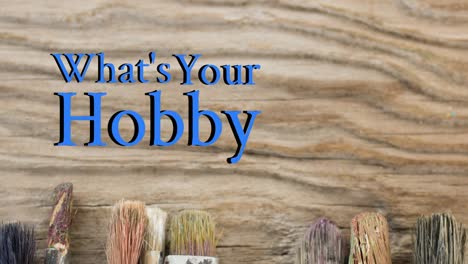 animation of what's your hobby text over paintbrushes wooden table top