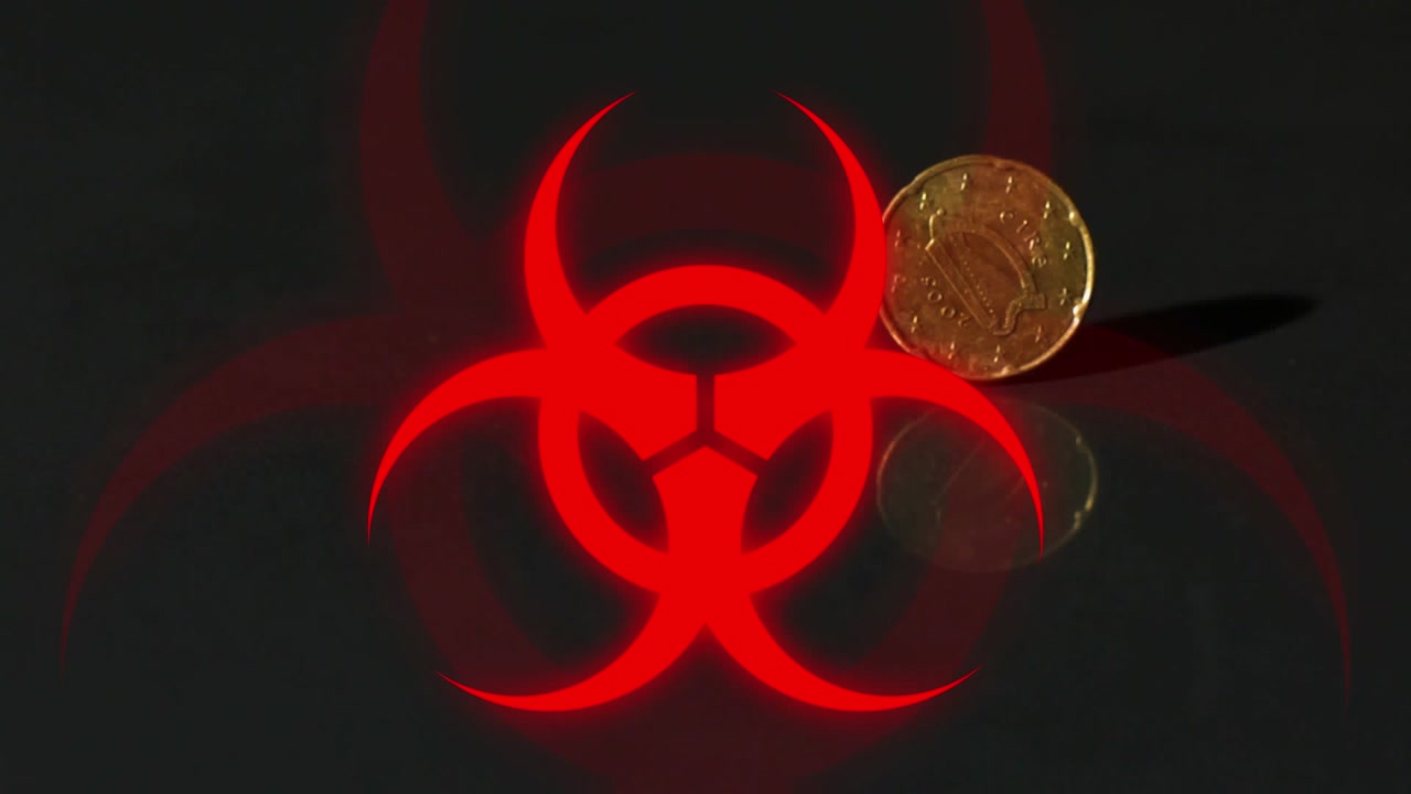 Animation of biohazard symbol over golden coin spinning against black background