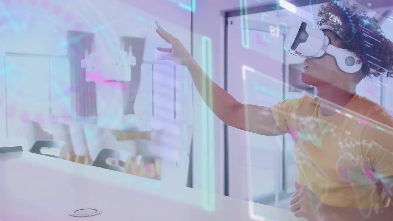 Man in VR headset lifting hand, pinching then extending fingers, exploring neon graphs in tech lab