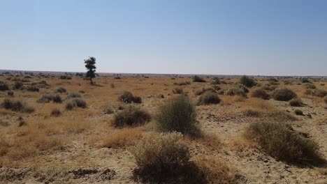 desert-landscape-barren-view-with-bright-blue-sky-at-day-from-flat-angle