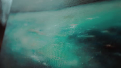 close up of teal abstract painting