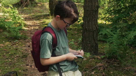 kid writing on notebook