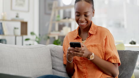 Black-woman-on-couch,-smartphone