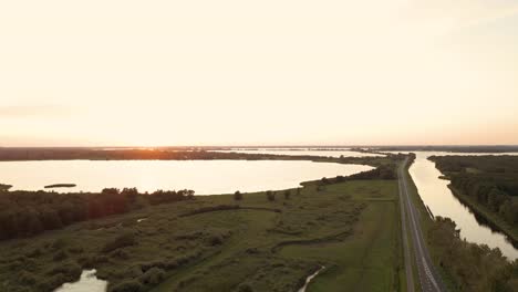 sunset over a canal and lake