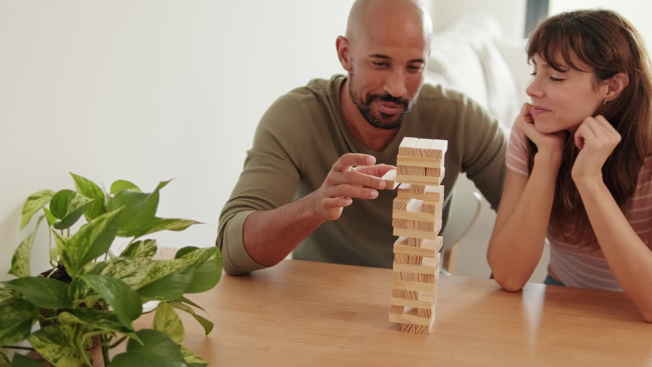 Couple Playing Jenga at Home
