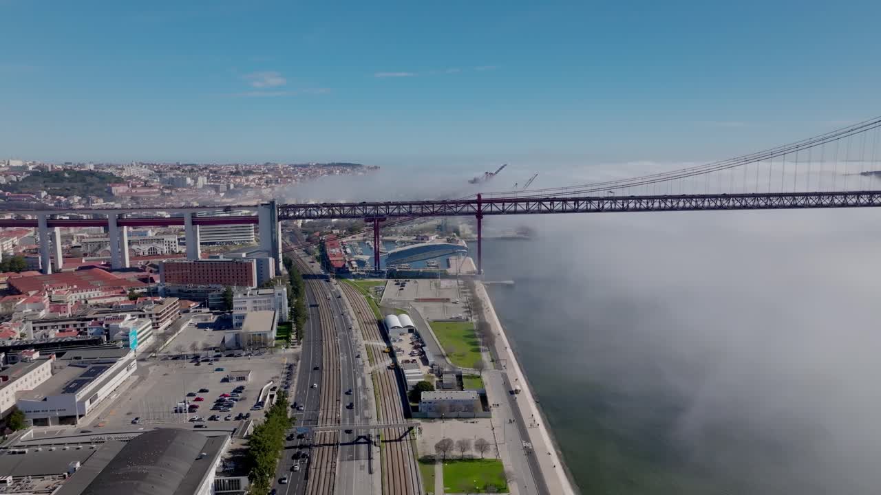 Drone shot of the fog under the bridge in Lisbon.