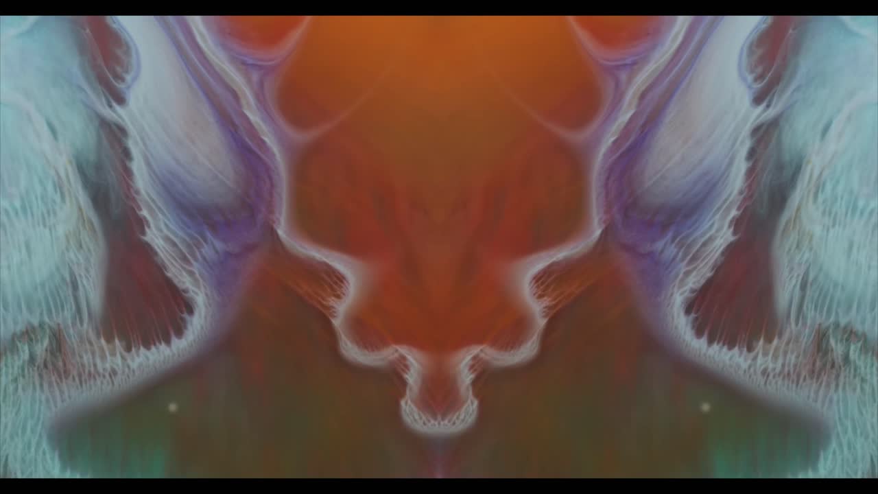 Vibrant Abstract Liquid Ink Flowing and Spreading in Symmetrical Patterns