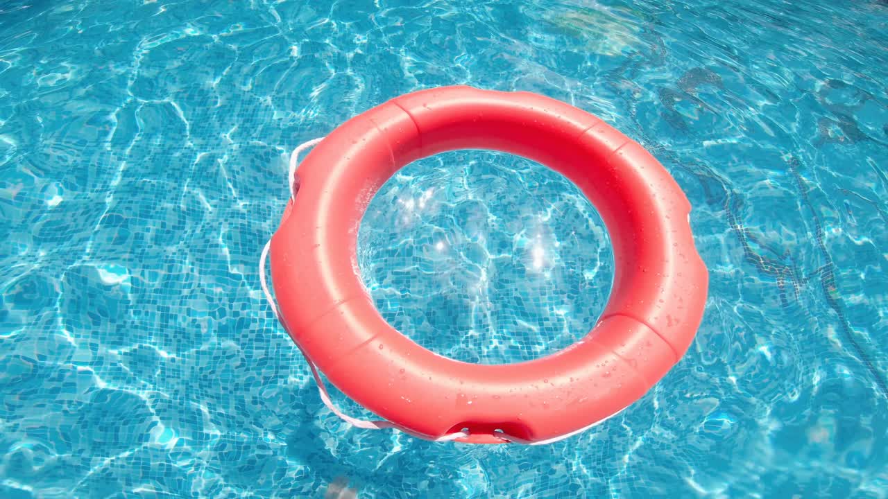 Orange Lifebuoy on the water. The concept of help, rescue, drowning, storm