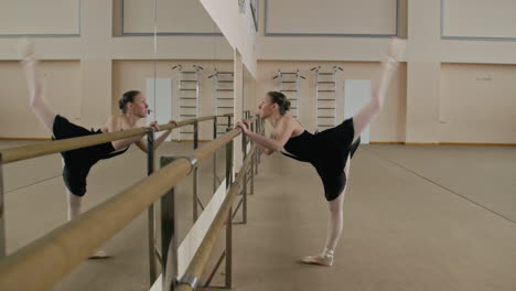 ballet dancer practicing at the barre