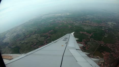 view from the aircraft window to the runway