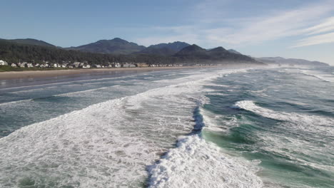 ocean waves approach the beach on the oregon coast