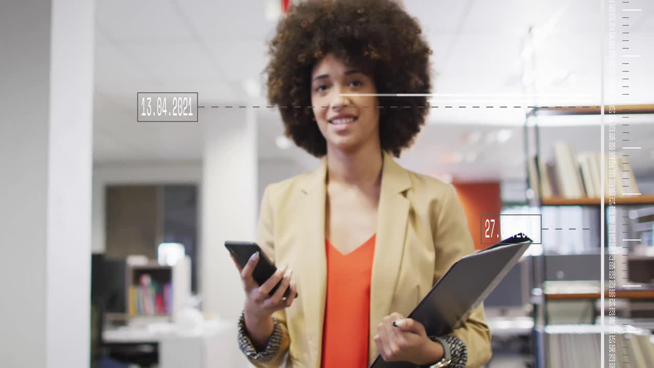 Animation of financial data processing over biracial businesswoman in office