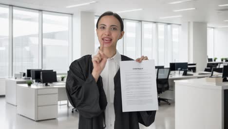 Happy-Indian-female-lawyer-explaining-the-document