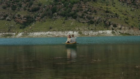 couple canoeing on a mountain lake