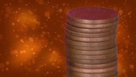 animation of dots over pile of coins on orange background