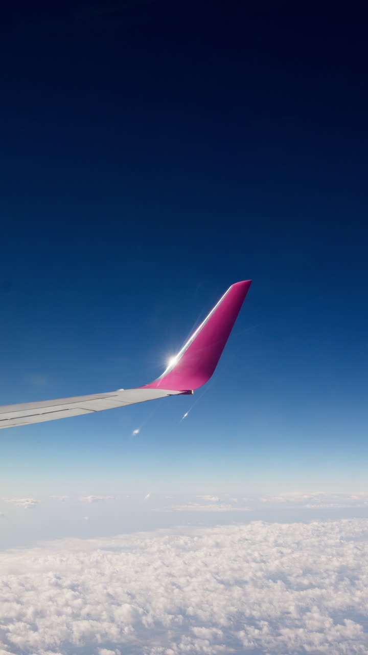 Airplane wing view above the clouds