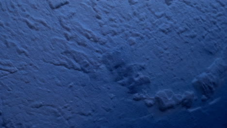 Close-up view of a textured blue surface