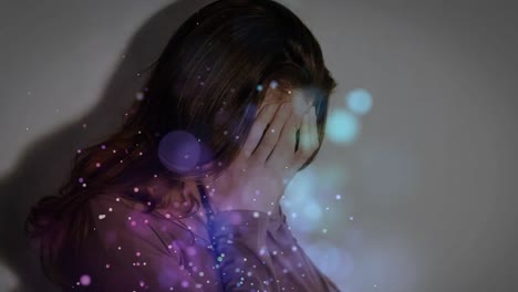 digital animation of upset woman covering her face. illuminated bubbles on foreground.