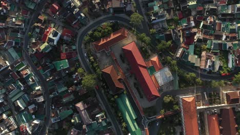 dalat city or da lat, vietnam top down drone shot over city center featuring winding roads with cars and motorbikes