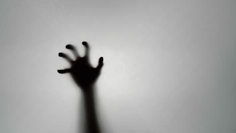 Shadowy Hand on Glass