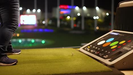 night golf practice at an indoor range