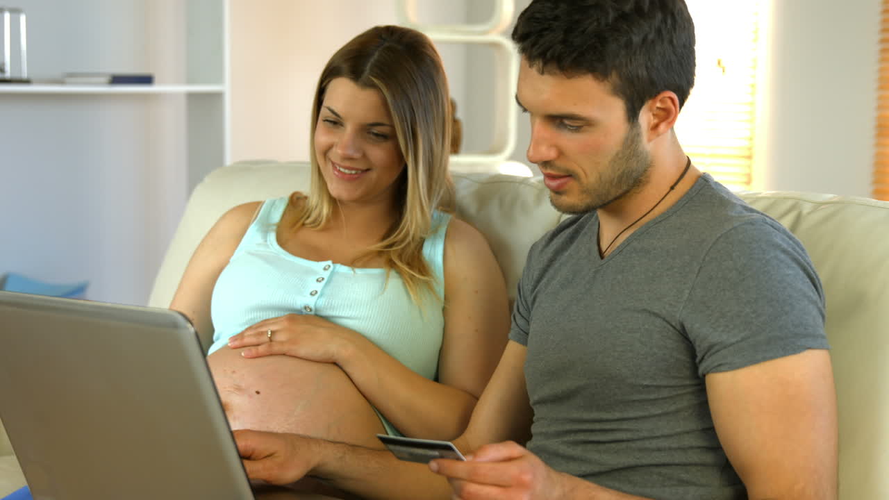 Happy couple surfing the web