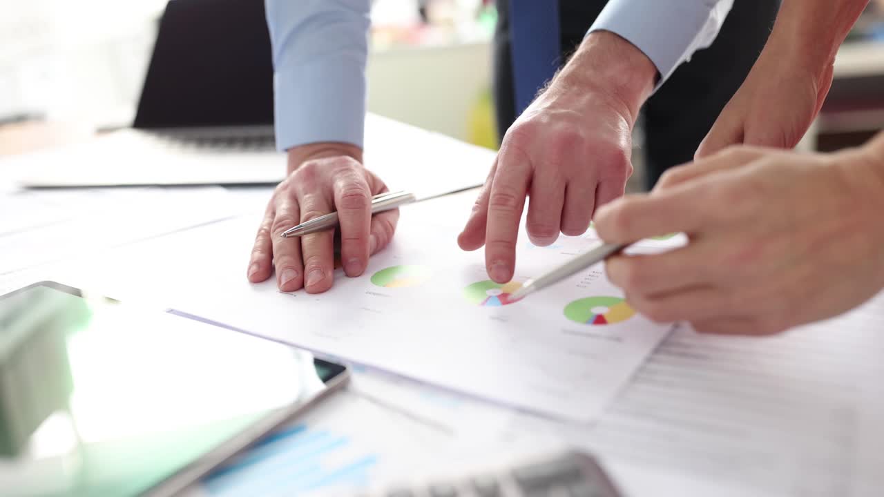 Colleagues discuss commercial financial performance of business