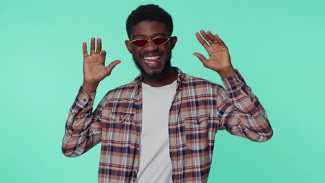 crazy man in fashion shirt demonstrating tongue out fooling around, making silly faces, madness