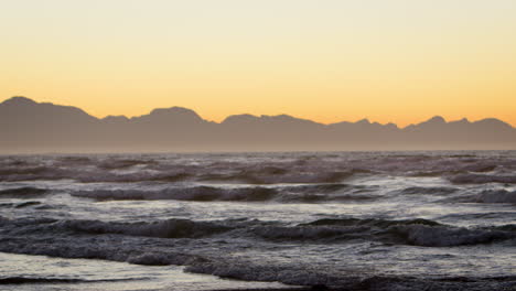 slow motion sequence of sunrise over beach in south africa