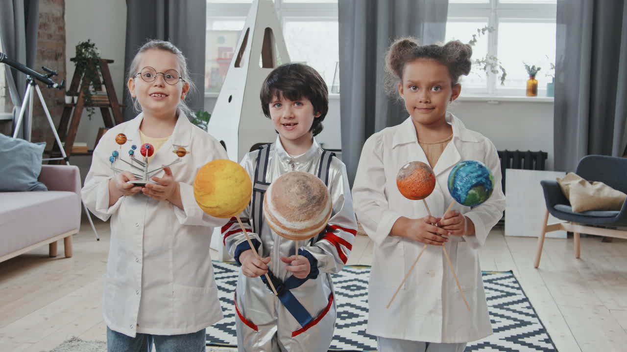 Portrait of Cute Kids with Toy Planets